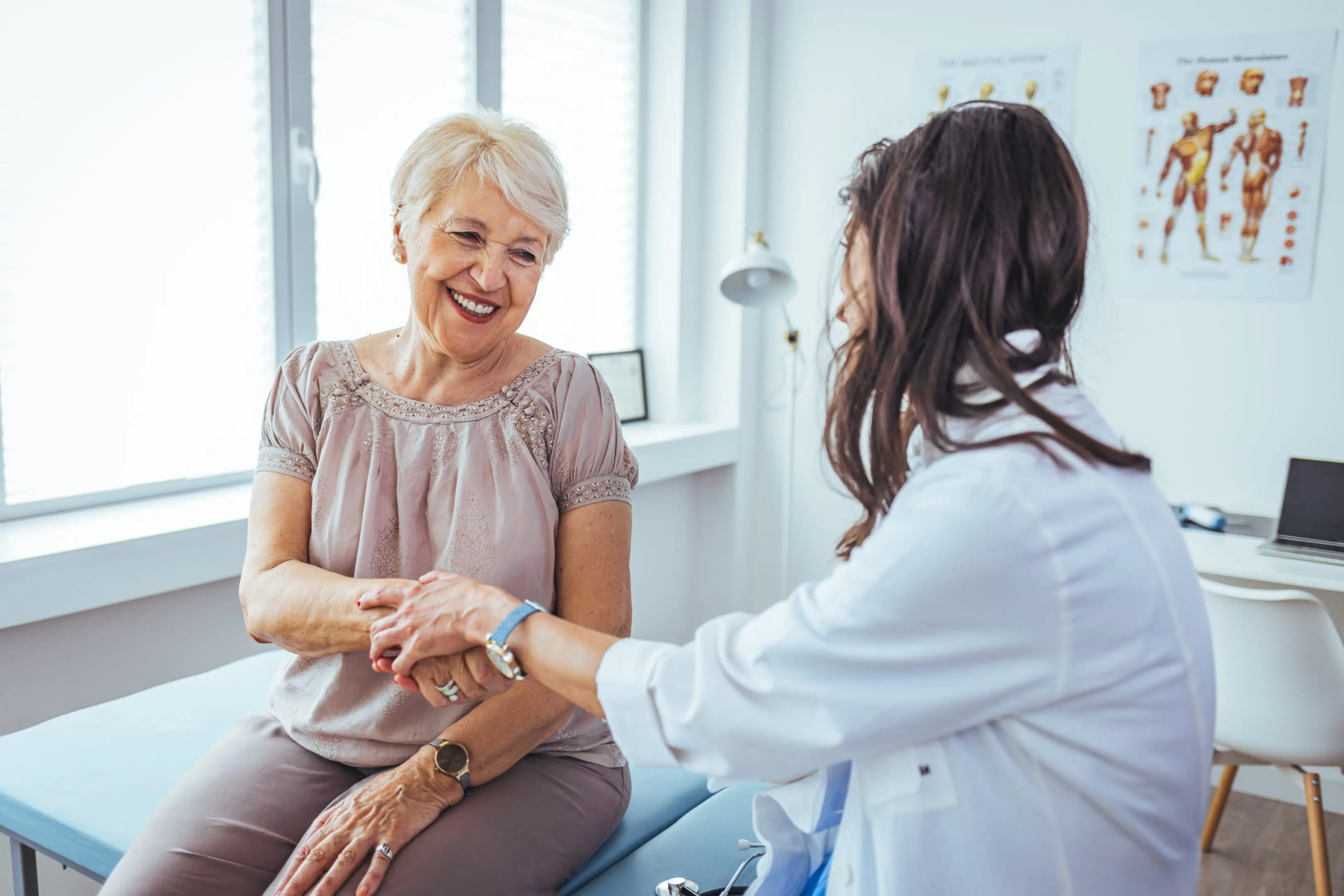 Hand of doctor reassuring her female patient. The doctor or pharmacist is discussing and encouraging the results of the treatment. With the patients who were examined, counseling ideas and treatment guidelines